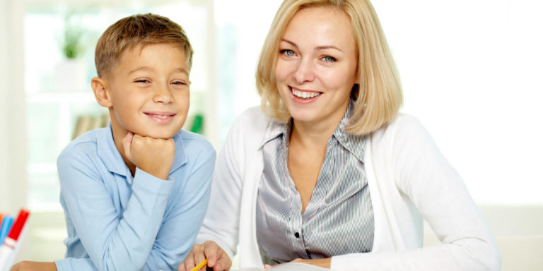 picture of a woman and a boy smiling