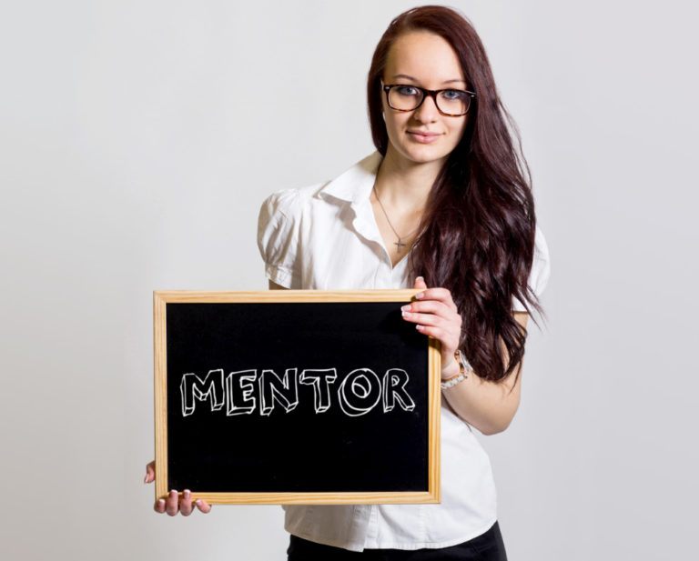 picture of a woman and a board written mentor