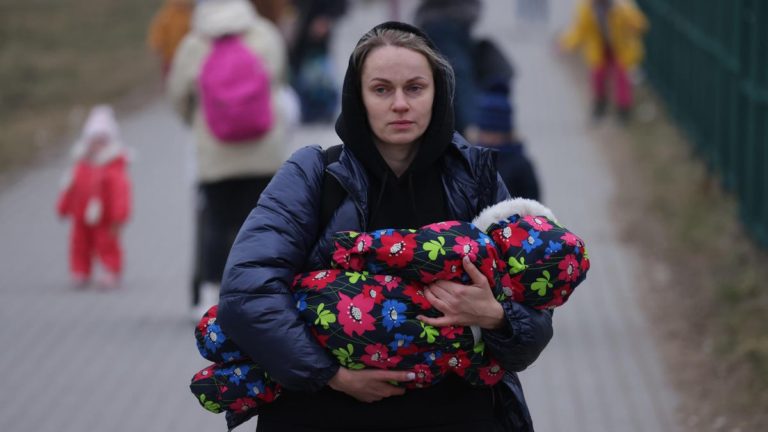 woman carring a baby